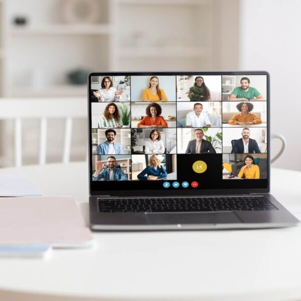 virtual team meeting on laptop in a bright home