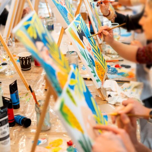 women enjoying a creative sip and paint event